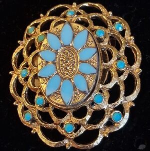 Vintage Goldtone Oval Brooch With Floral Center, Filogree Border, Blue Stones